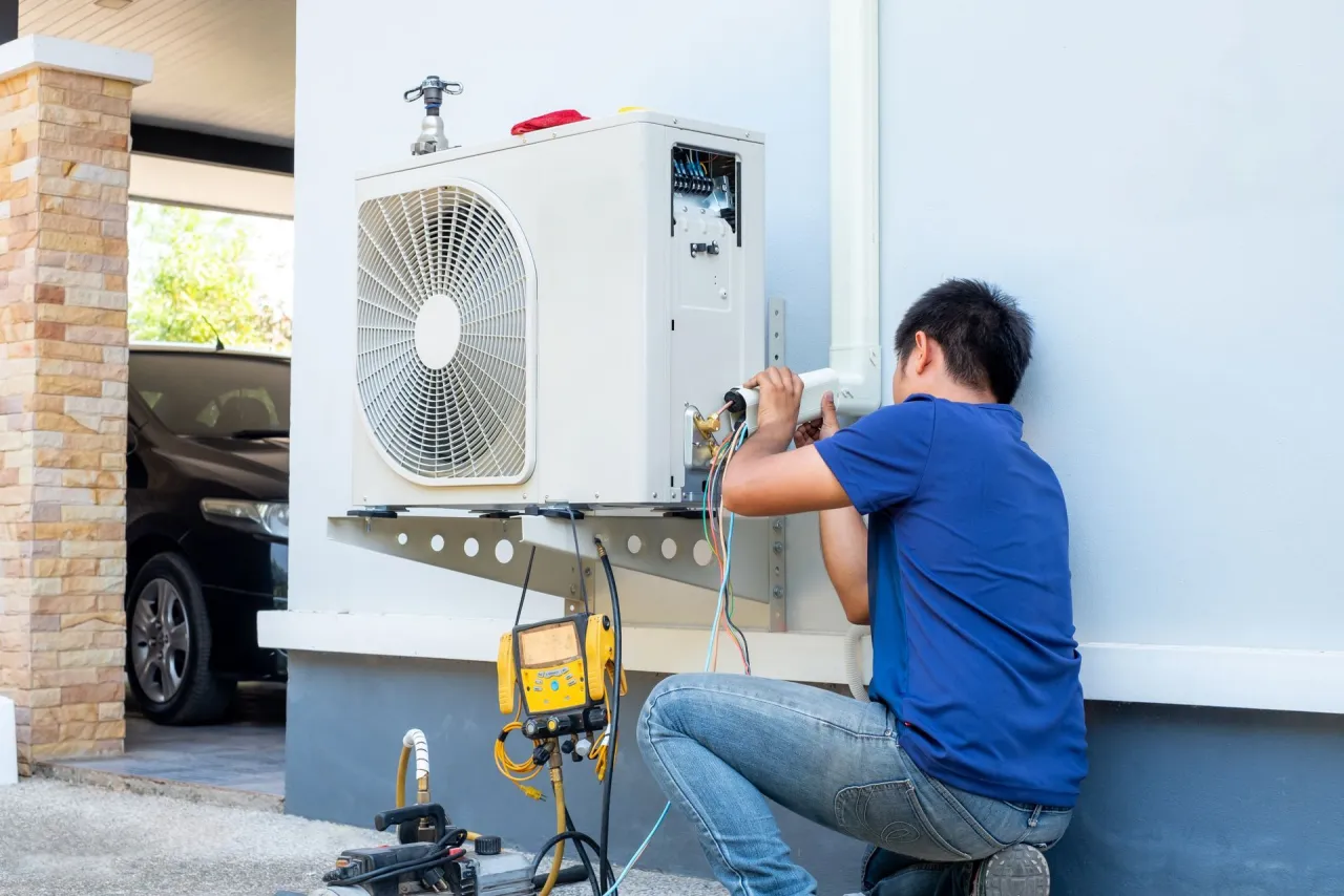 Technician repairing an air conditioning motor for a Granite City, IL customer
